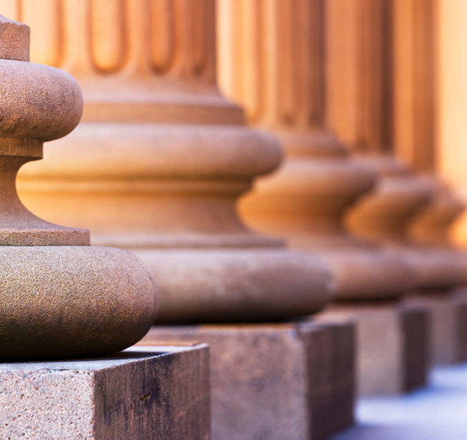 Close up on the detail of column pillars outside of a building